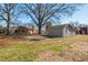 Spacious backyard with patio, shed, and view of the home at 6017 Charlana Dr, Durham, NC 27712