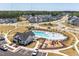 Aerial view showcasing the community pool, playground, parking lot, and surrounding homes at 616 Emerald Bay Cir, Raleigh, NC 27610