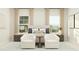 Bright bedroom featuring neutral tones, two lounge chairs, large windows, and modern decor accents at 616 Emerald Bay Cir, Raleigh, NC 27610