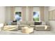 Comfortable living room with plush sectional sofa and ample natural light at 616 Emerald Bay Cir, Raleigh, NC 27610