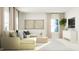 Bright living room boasts natural light, stylish furniture and a leafy green plant at 616 Emerald Bay Cir, Raleigh, NC 27610