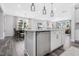 Open concept kitchen with a stainless steel dishwasher, stainless steel appliances, and a kitchen island at 625 Emerald Bay Cir, Raleigh, NC 27610