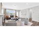 Living room with a large window and modern furniture at 625 Emerald Bay Cir, Raleigh, NC 27610