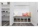 Mud room featuring a bench with storage baskets and hooks, perfect for organization at 625 Emerald Bay Cir, Raleigh, NC 27610