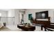 Cozy loft area with a TV, comfortable seating, modern decor, and neutral color palette at 641 Emerald Bay Cir, Raleigh, NC 27610