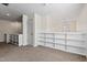 Bright loft space with a wall of shelving, ideal for storage or display at 6534 Rossford Ln, Durham, NC 27713