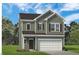 Charming two-story home with neutral siding, a two-car garage and well-maintained landscaping at 68 Commons Cir # 223, Clayton, NC 27520