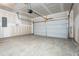 Spacious garage with concrete floor and a garage door at 68 Commons Cir # 223, Clayton, NC 27520