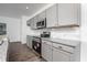 Modern kitchen with granite countertops, stainless steel appliances, and stylish cabinetry at 68 Commons Cir # 223, Clayton, NC 27520