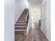 View of staircase with carpet and hardwood floors at 68 Commons Cir # 223, Clayton, NC 27520