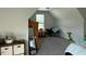 Large finished attic with plush gray carpet and ample storage at 70 Maxwell Pl, Lillington, NC 27546