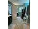 Spacious, turquoise bathroom with a soaking tub and vanity at 70 Maxwell Pl, Lillington, NC 27546