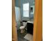 Cozy bathroom featuring a vanity with a dark cabinet, a toilet, and a shower with a curtain at 70 Maxwell Pl, Lillington, NC 27546