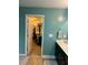This bright bathroom features a door to a walk-in closet and a vanity at 70 Maxwell Pl, Lillington, NC 27546