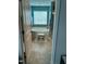 Bright bathroom with a soaking tub and window at 70 Maxwell Pl, Lillington, NC 27546