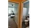 Bathroom with white toilet, gray patterned shower curtain, next to bedroom with elliptical at 70 Maxwell Pl, Lillington, NC 27546