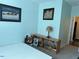 Cozy bedroom with soft blue walls, plush carpet and a rustic bookcase at 70 Maxwell Pl, Lillington, NC 27546