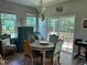 Bright dining area featuring a round table, access to a deck, and natural light at 70 Maxwell Pl, Lillington, NC 27546