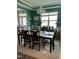Bright dining room with a dark wood table and seating for six at 70 Maxwell Pl, Lillington, NC 27546