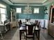 Well decorated dining room with large windows and a view of the surrounding landscape at 70 Maxwell Pl, Lillington, NC 27546
