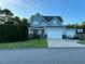 Charming two-story home with a well-manicured lawn and a two-car garage at 70 Maxwell Pl, Lillington, NC 27546