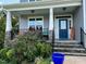 Inviting front porch with stone accents, and a cozy seating area at 70 Maxwell Pl, Lillington, NC 27546