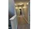 Upstairs hallway with neutral colors at 70 Maxwell Pl, Lillington, NC 27546