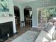 Open living space featuring a fireplace, access to a dining area and deck at 70 Maxwell Pl, Lillington, NC 27546
