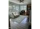 Cozy sitting room featuring a comfortable couch, desk, and bookshelves, perfect for work or relaxation at 70 Maxwell Pl, Lillington, NC 27546