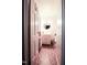 A bathroom with tiled floors, a sink, toilet, mirror, and a window with blind at 711 Stuart Dr, Sanford, NC 27330