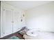 Calm bedroom featuring ample closet space, neutral tones, and soft carpet flooring at 711 Stuart Dr, Sanford, NC 27330