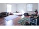 Bright playroom/bedroom featuring hardwood flooring, cozy seating, and ample play space at 711 Stuart Dr, Sanford, NC 27330