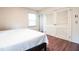 Bedroom features hardwood floors, closet and a window with blind to let light in at 711 Stuart Dr, Sanford, NC 27330