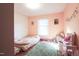 Charming bedroom with soft hues, play area, and natural light from the window at 711 Stuart Dr, Sanford, NC 27330