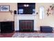 Elegant fireplace with a decorative mantel and hearth, flanked by stylish decor at 711 Stuart Dr, Sanford, NC 27330