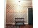 Entryway featuring hardwood floors, patterned wallpaper and a charming wooden bench at 711 Stuart Dr, Sanford, NC 27330
