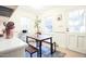 Bright eat-in kitchen featuring a table, rug, and large windows for natural light at 711 Stuart Dr, Sanford, NC 27330