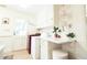 Well-lit laundry area with modern washer/dryer, storage cabinets, and convenient folding counter at 711 Stuart Dr, Sanford, NC 27330