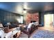 Inviting living space with a brick fireplace, comfortable seating, and natural lighting at 711 Stuart Dr, Sanford, NC 27330