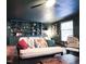 Relaxing living room with built-in shelving, comfortable seating, and decorative elements at 711 Stuart Dr, Sanford, NC 27330