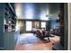 Cozy living room featuring built-in shelves, decorative fireplace, and abundant seating at 711 Stuart Dr, Sanford, NC 27330