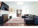 Comfortable living room with a fireplace and a plush sectional sofa on a decorative rug at 711 Stuart Dr, Sanford, NC 27330
