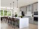Bright kitchen with stainless steel appliances, island with seating and sleek countertops at 806 Hyperion Aly, Wake Forest, NC 27587