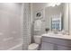 Clean bathroom featuring a shower-tub combination and modern vanity with a decorative plant at 812 Emerald Bay Cir, Raleigh, NC 27610