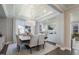 Formal dining room boasts a unique tray ceiling, modern chandelier, and large windows for natural light at 812 Emerald Bay Cir, Raleigh, NC 27610