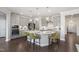 Well-equipped kitchen with a large island, stainless steel appliances, and ample cabinet space for storage at 812 Emerald Bay Cir, Raleigh, NC 27610