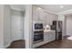 Modern kitchen with stainless steel appliances, built in microwave, and stylish gray cabinets at 812 Emerald Bay Cir, Raleigh, NC 27610