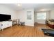 Spacious finished basement area with laminate flooring and ample natural light at 8124 Primanti Blvd, Raleigh, NC 27612