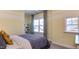 Cozy bedroom with large window, stylish curtains, and neutral-toned bedding, creating a relaxing atmosphere at 840 Emerald Bay Cir, Raleigh, NC 27610