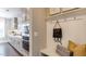 Bright kitchen features stainless steel appliances, white cabinetry, and dark hardwood flooring at 840 Emerald Bay Cir, Raleigh, NC 27610